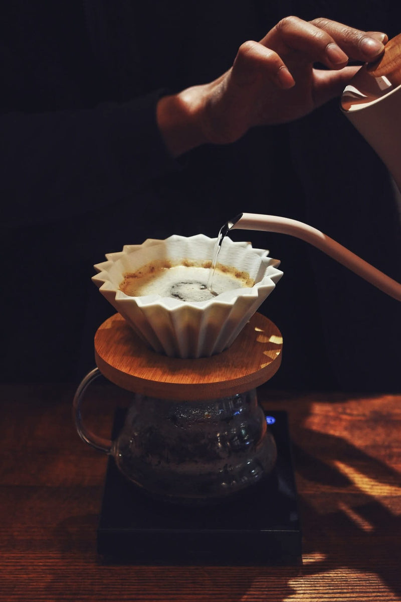 Pour-over and phin setup with scale — coffee quiz invitation.